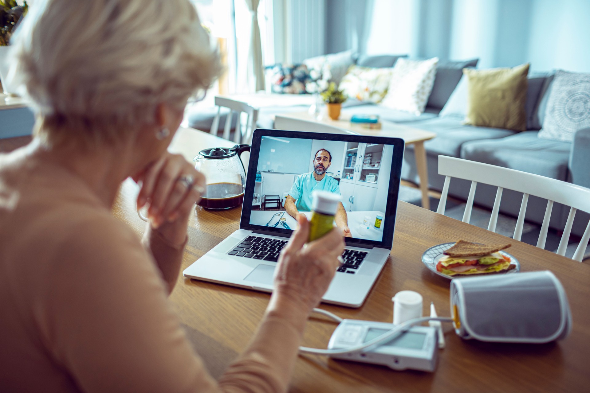 Senior Woman consulting with her doctor online